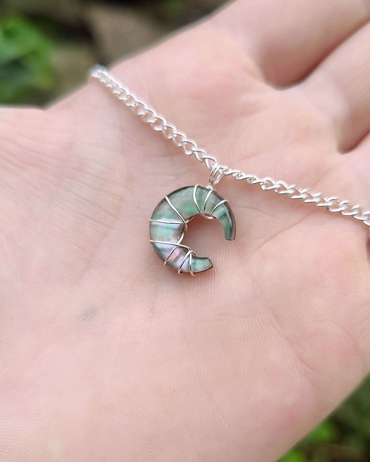 Delicate silver Aroura Opal moon necklace. It is a super cute moon pendant for the everyday. 